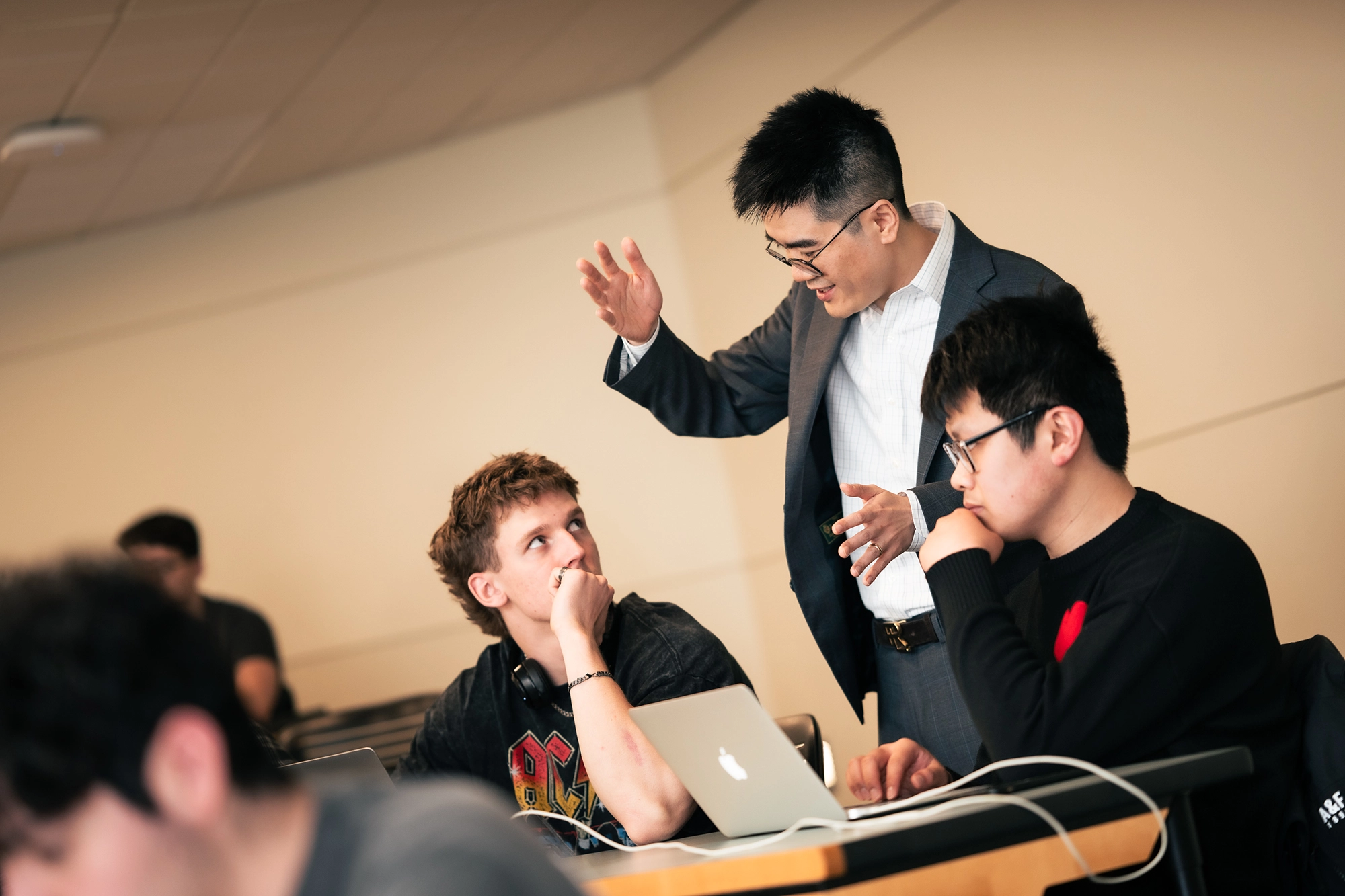 Supply Chain professor, Tao Lu instructing students in Classroom